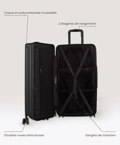 Valise Trunk L Intemporelle GYL en polycarbonate 71 cm coloris noir, interieur ouvert, 2 etageres de rangement, sangles de maintien, coque en polycarbonate et doubles roues