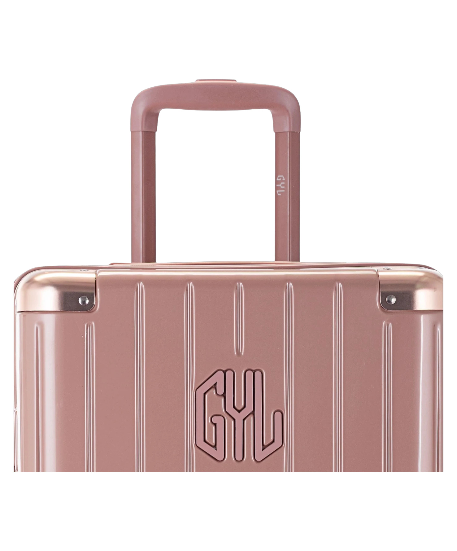 Valise Trunk L Intemporelle GYL en polycarbonate 71 cm coloris rose gold gros plan sur la poignee trolley et les coins renforces