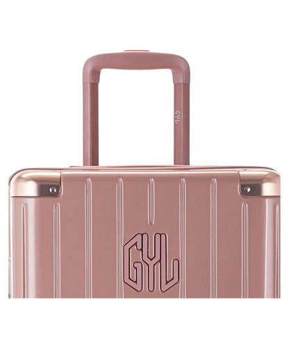 Valise Trunk L Intemporelle GYL en polycarbonate 71 cm coloris rose gold gros plan sur la poignee trolley et les coins renforces