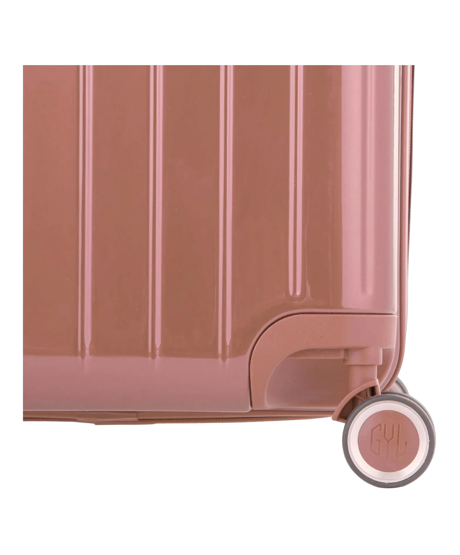 Detail de la roue et du logo GYL sur le bas de la valise trunk L rose gold