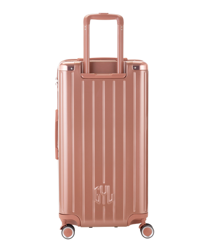 Valise Trunk L Intemporelle GYL en polycarbonate 71 cm coloris rose gold vue de dos avec trolley telescopique deploye