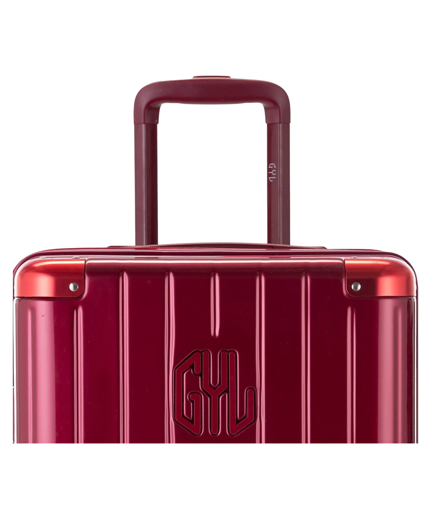 Valise Trunk L Intemporelle GYL en polycarbonate 71 cm coloris rouge fonce gros plan sur la poignee trolley et les coins renforces