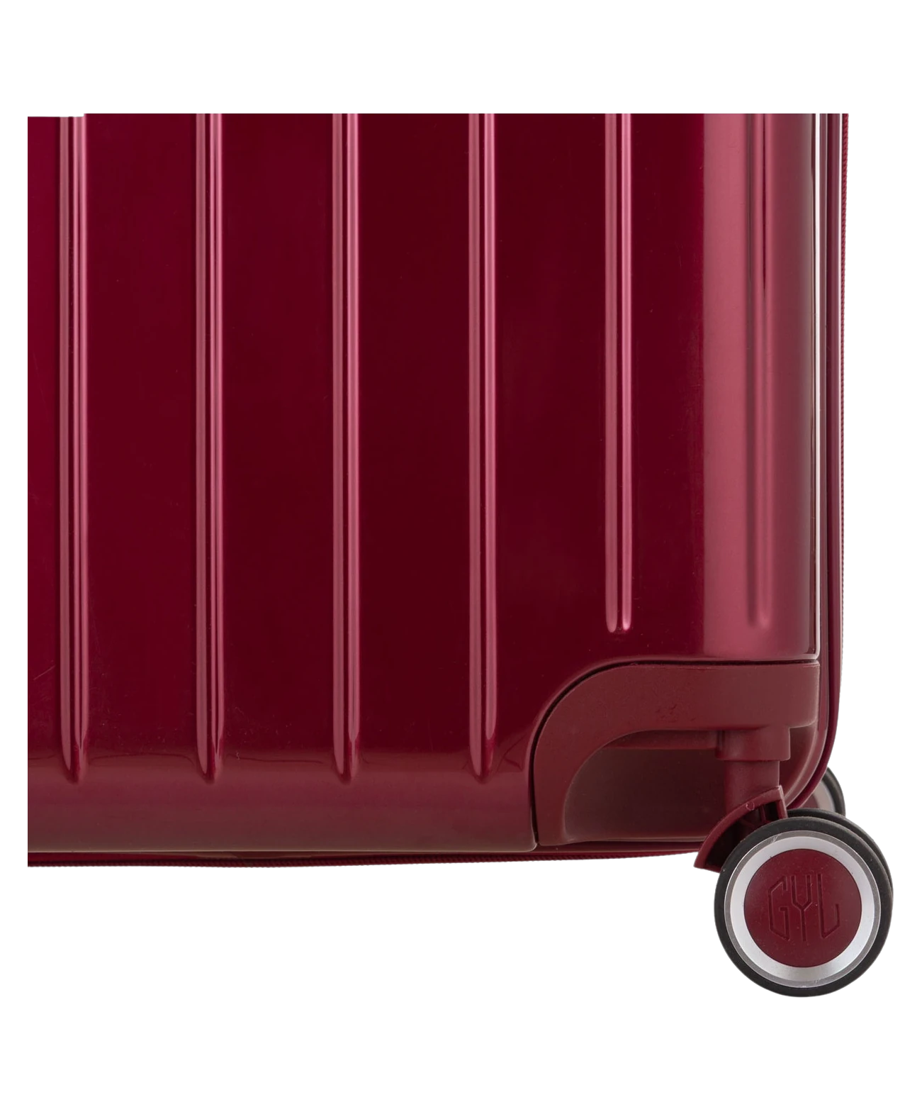 Valise Trunk L Intemporelle GYL en polycarbonate 71 cm coloris rouge fonce gros plan sur une roulette double 360 degres siglee GYL