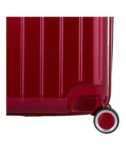 Detail de la roue et du logo GYL sur le bas de la valise trunk L rouge fonce