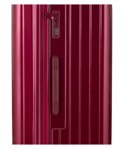 Valise Trunk L Intemporelle GYL en polycarbonate 71 cm coloris rouge fonce gros plan sur la serrure TSA et la fermeture eclair