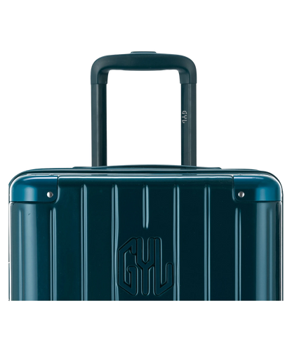 Valise Trunk L Intemporelle GYL en polycarbonate 71 cm coloris sapin gros plan sur la poignee trolley et les coins renforces