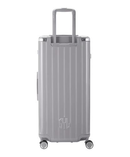 Valise Trunk XL Intemporelle GYL en polycarbonate 78 cm coloris argent vue de dos avec trolley telescopique deploye