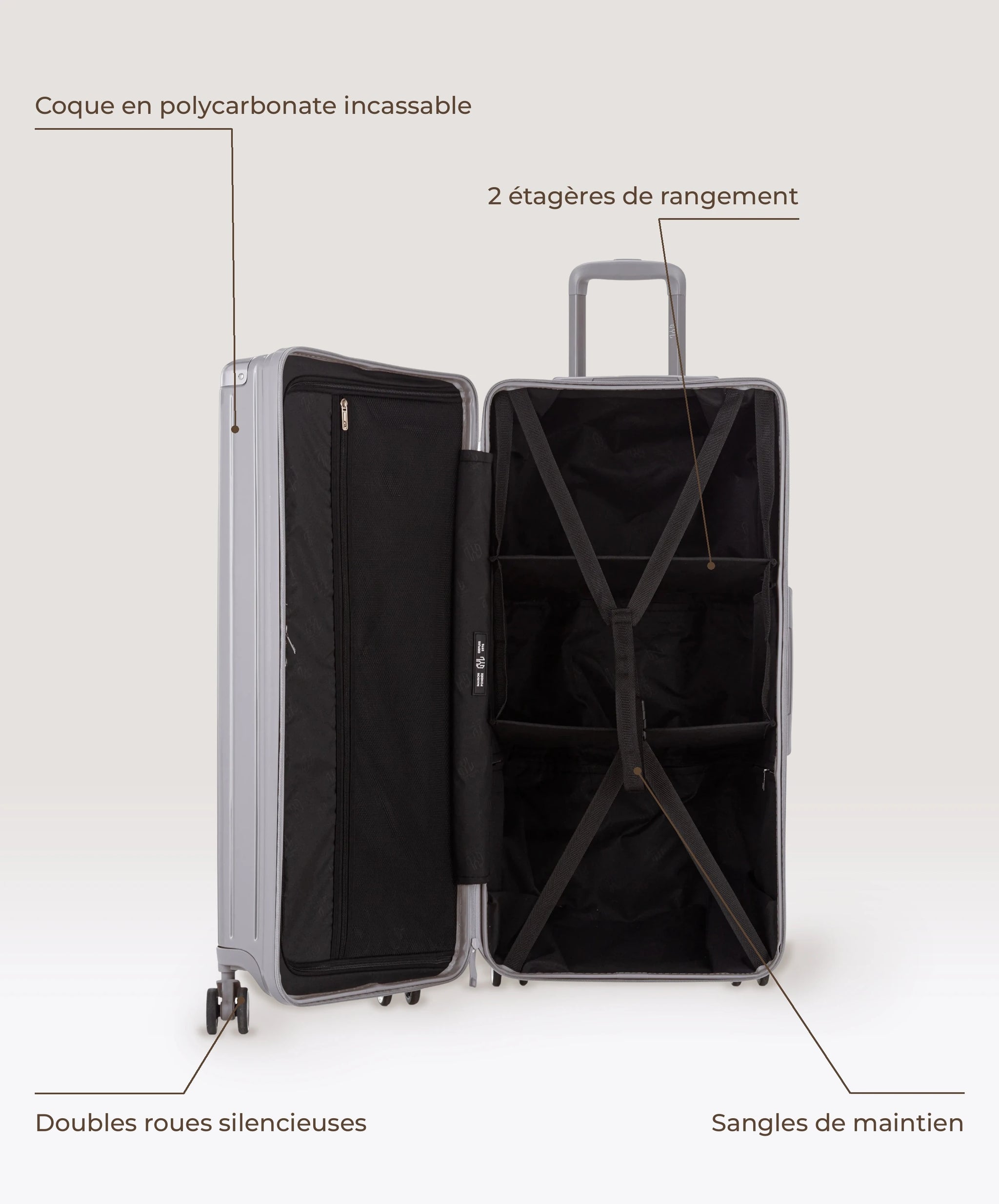 Valise Trunk XL Intemporelle GYL en polycarbonate 78 cm coloris argent, interieur ouvert, 2 etageres de rangement, sangles de maintien, coque en polycarbonate et doubles roues