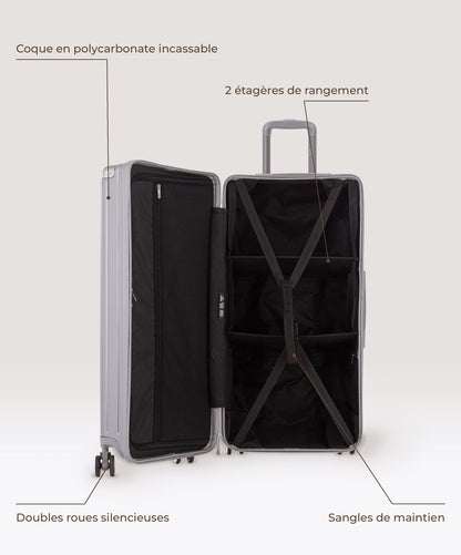 Valise Trunk XL Intemporelle GYL en polycarbonate 78 cm coloris argent, interieur ouvert, 2 etageres de rangement, sangles de maintien, coque en polycarbonate et doubles roues