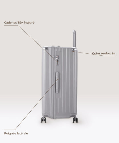 Valise Trunk XL Intemporelle GYL en polycarbonate 78 cm coloris argent, vue de profil, cadenas TSA integre, poignee laterale et coins renforces