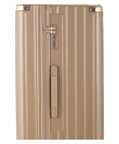 Valise Trunk XL Intemporelle GYL en polycarbonate 78 cm coloris champagne gros plan sur la serrure TSA et la fermeture eclair