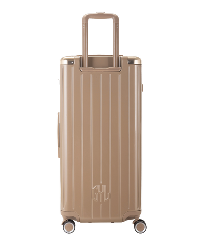 Valise Trunk XL Intemporelle GYL en polycarbonate 78 cm coloris champagne vue de dos avec trolley telescopique deploye