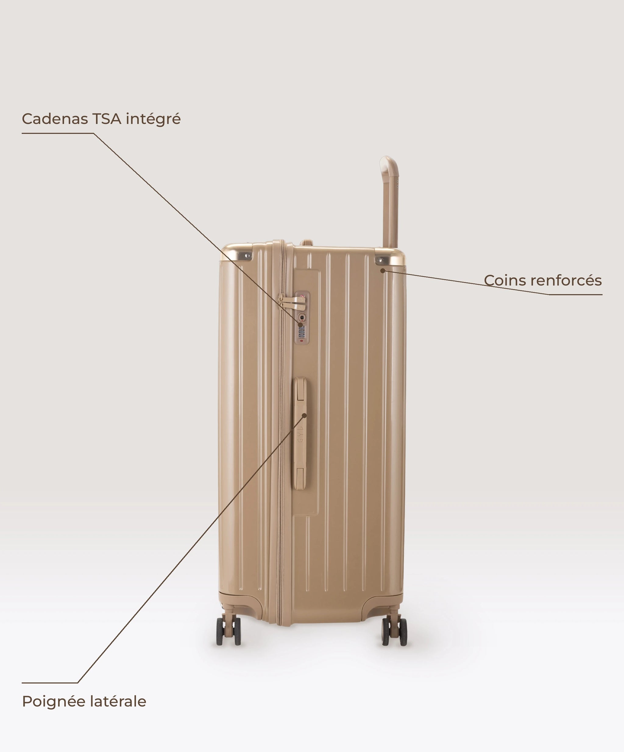 Valise Trunk XL Intemporelle GYL en polycarbonate 78 cm coloris champagne, vue de profil, cadenas TSA integre, poignee laterale et coins renforces