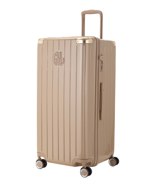 Valise Trunk GYL en polycarbonate Trunk XL 80 cm coloris champagne vue trois quarts avant