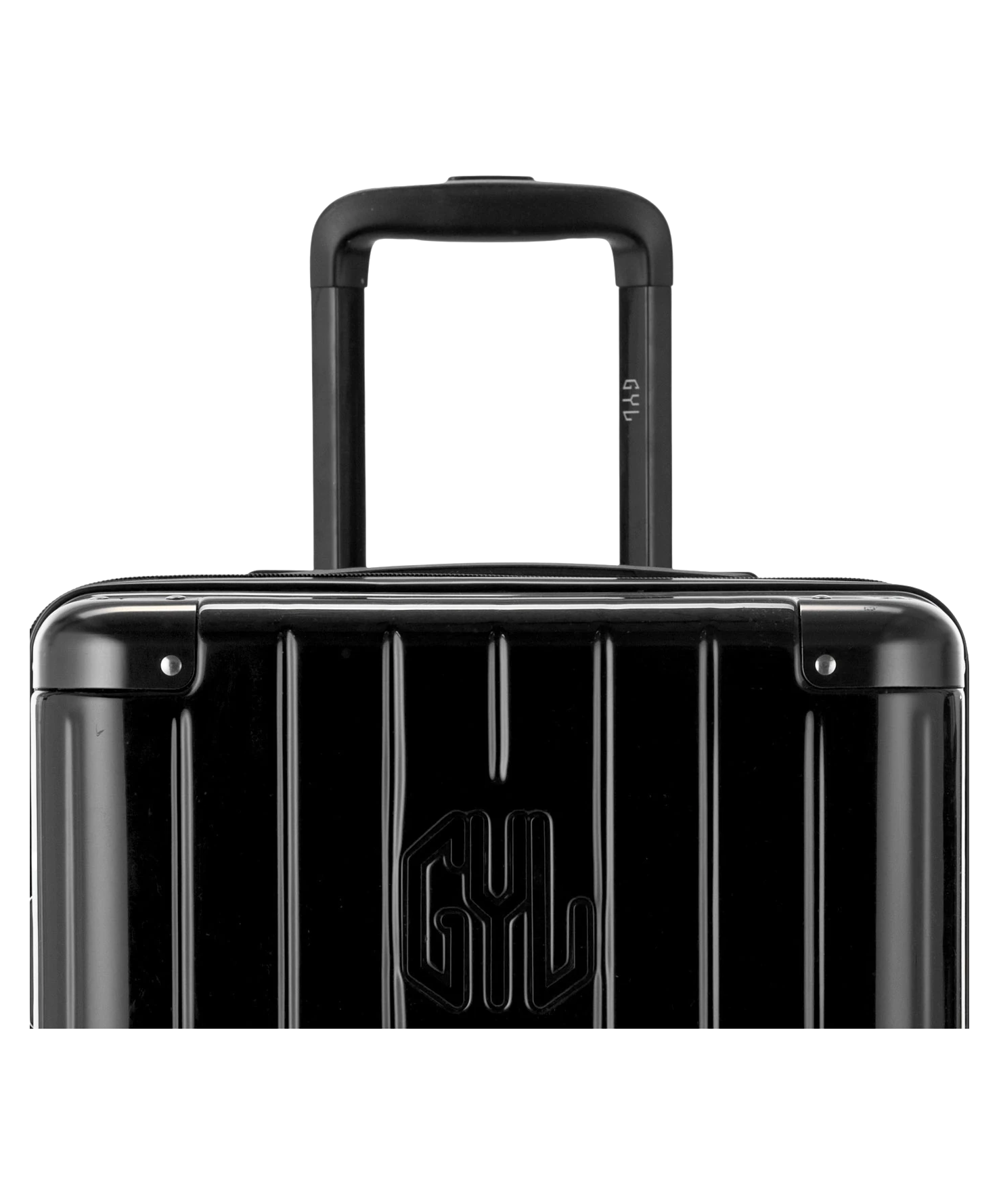 Valise Trunk XL Intemporelle GYL en polycarbonate 78 cm coloris noir gros plan sur la poignee trolley et les coins renforces