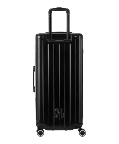 Valise Trunk XL Intemporelle GYL en polycarbonate 78 cm coloris noir vue de dos avec trolley telescopique deploye