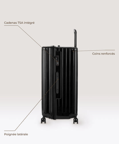 Valise Trunk XL Intemporelle GYL en polycarbonate 78 cm coloris noir, vue de profil, cadenas TSA integre, poignee laterale et coins renforces
