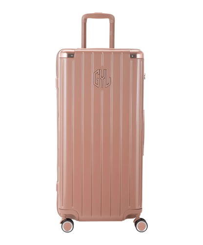 Valise Trunk XL Intemporelle GYL en polycarbonate 78 cm coloris rose gold vue de face avec logo GYL en relief