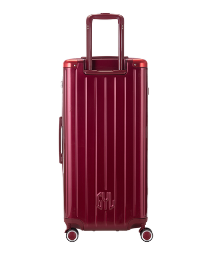 Valise Trunk XL Intemporelle GYL en polycarbonate 78 cm coloris rouge fonce vue de dos avec trolley telescopique deploye