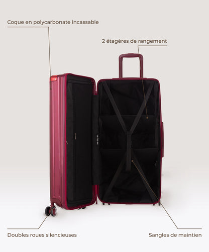 Valise Trunk XL Intemporelle GYL en polycarbonate 78 cm coloris rouge fonce, interieur ouvert, 2 etageres de rangement, sangles de maintien, coque en polycarbonate et doubles roues
